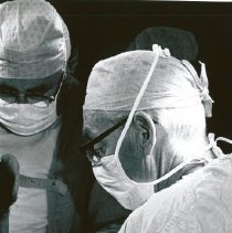 Dr. Leo Delaney and Dr. Lawrence Smit6h in surgery.